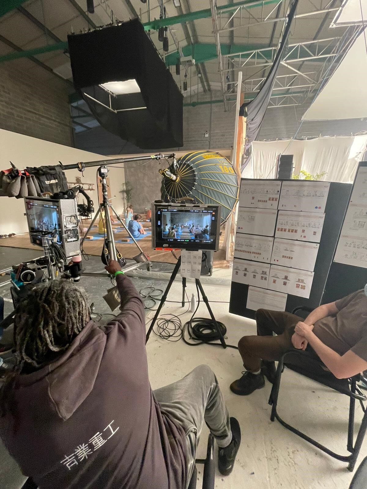 Film studio in production, camera operator adjusting a set up