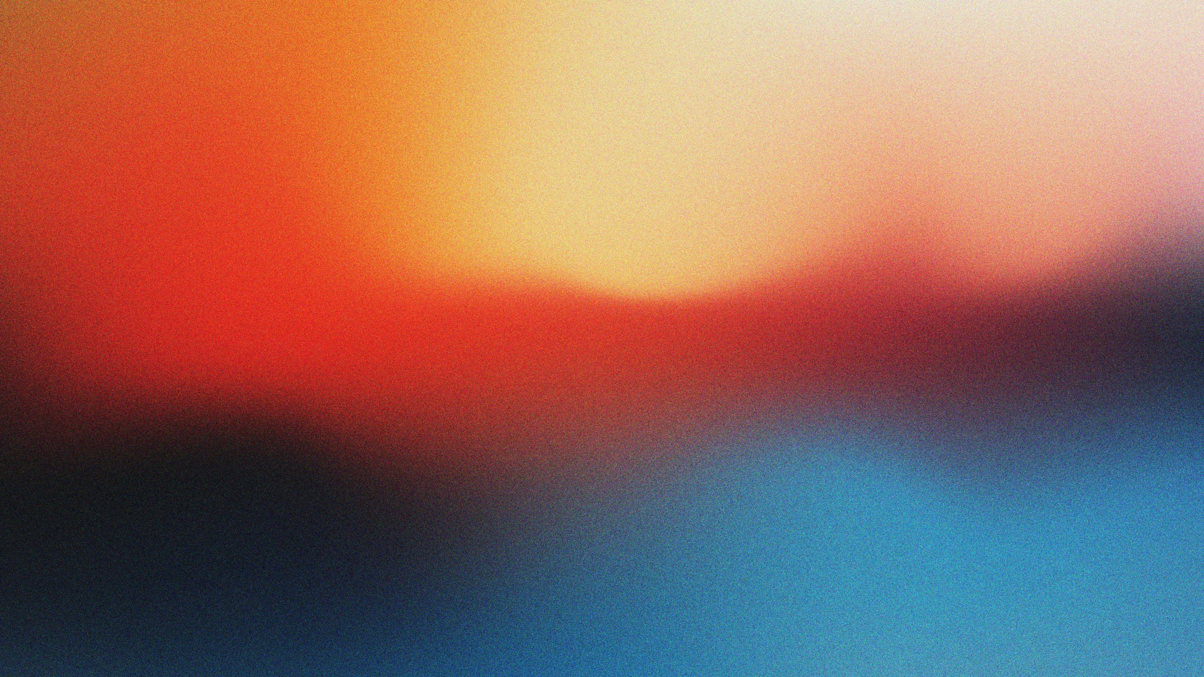 Artistic background image with colour fields blending into each other, red, yellow, blue