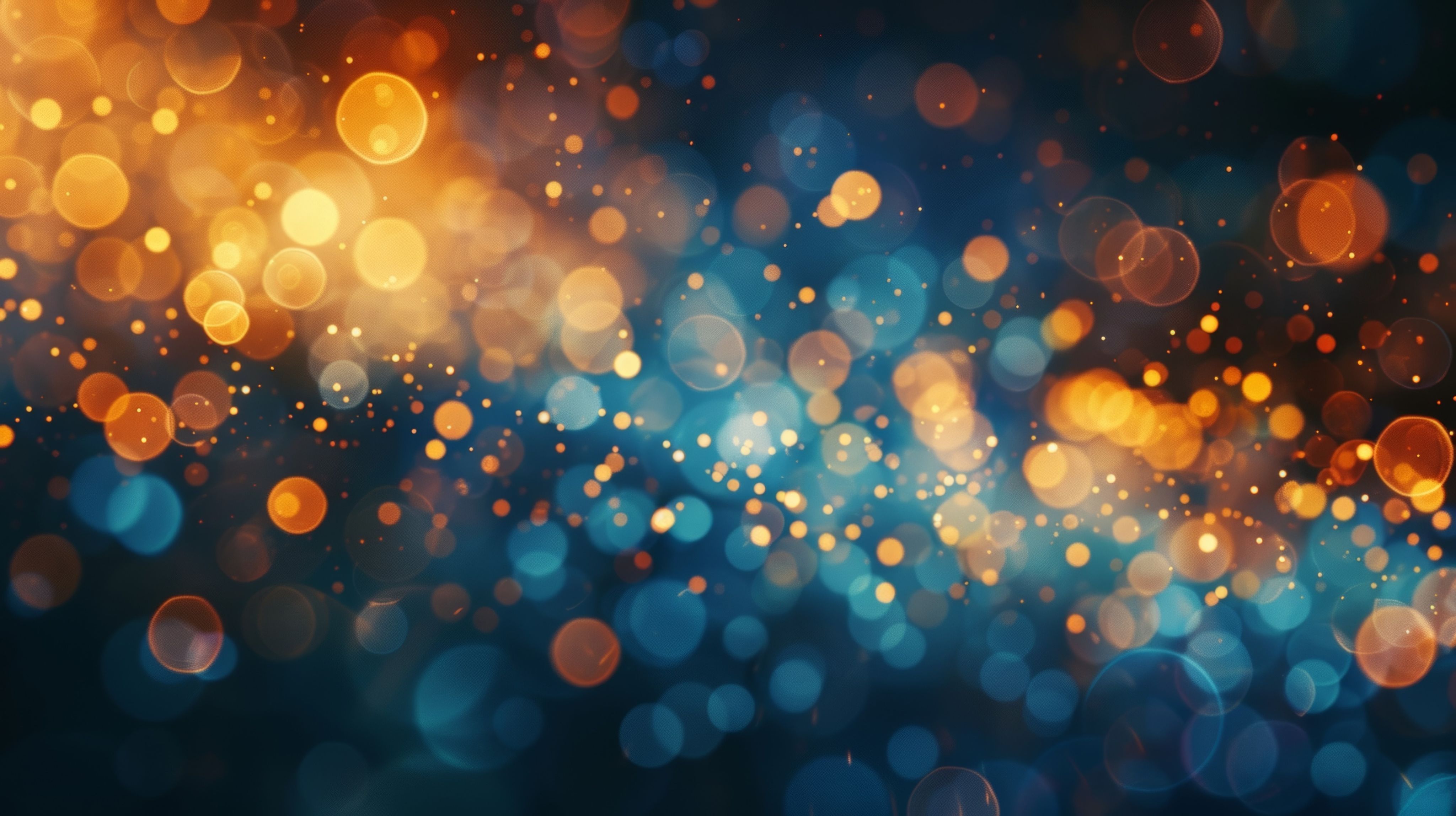 Artistic image of golden and silver light specs against a dark background