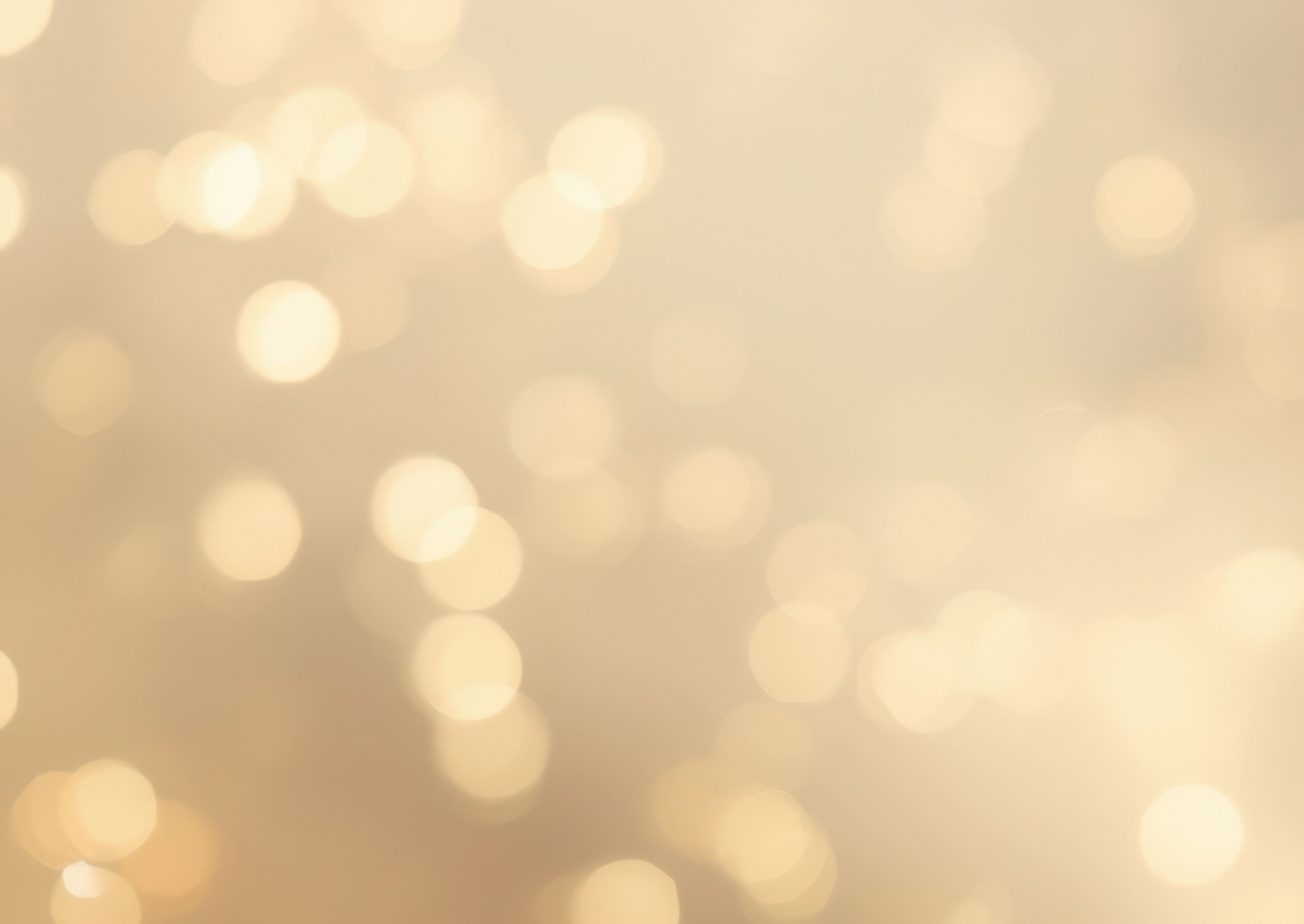 Beige background with light specs